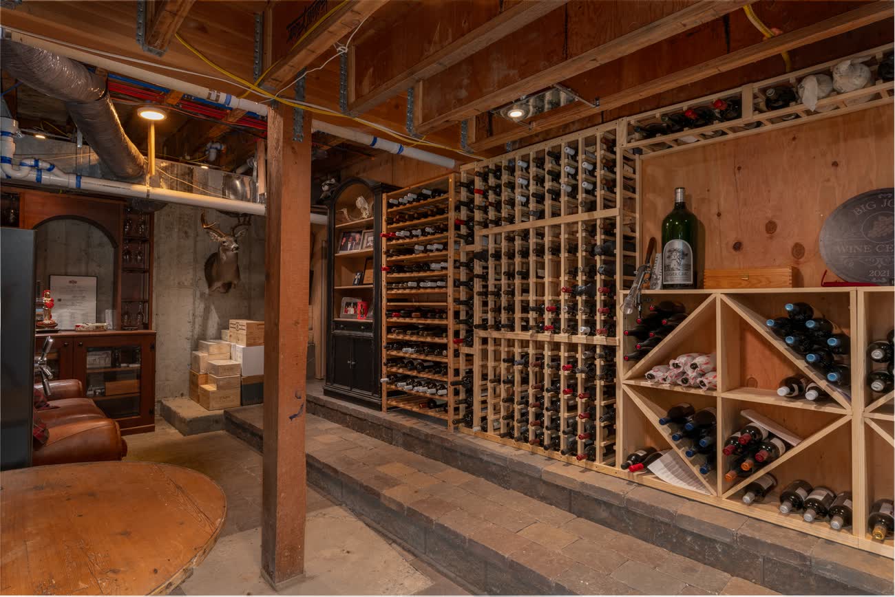 Timber-racked wine room on the lower level