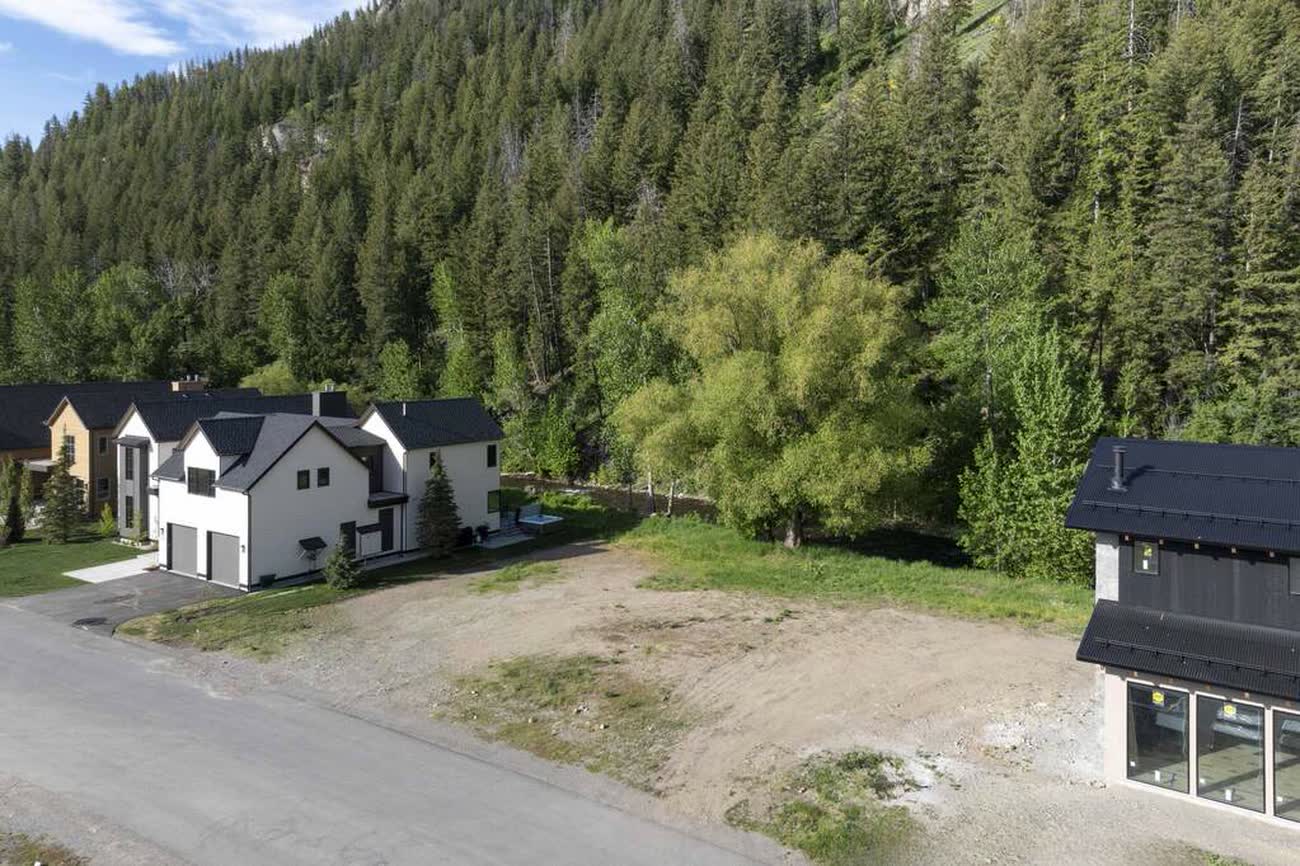 Completed contemporary residences along Mountain Creek Drive with the homesite in the foreground