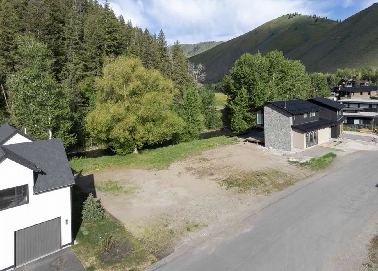 Street-level view of the homesite between two completed residences